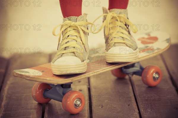 Legs of skateboarder. Closeup view