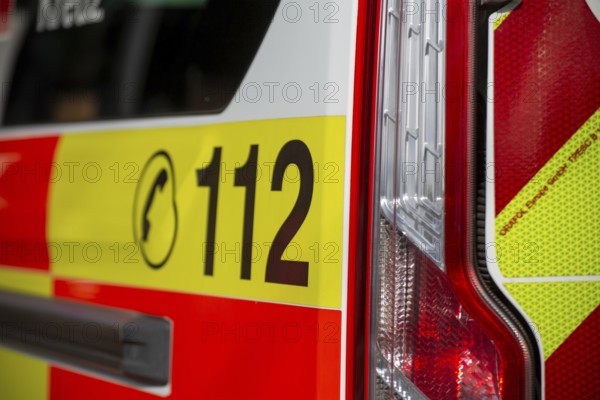 Close-up of the emergency number 112 on a DRK (German Red Cross) ambulance
