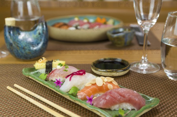 Platter with different types of nigirizushi, nigiri with different fish and one decorated with a