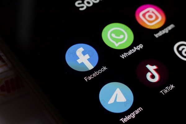 In this photo illustration, WhatsApp, Facebook, Instagram, Telegram, TikTok and Threads apps
