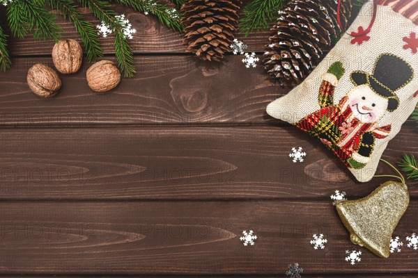 Christmas background Fir branches, cones and nuts on a wooden table. Space for text, View from