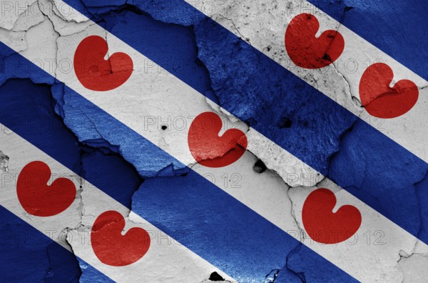 Flag of Friesland painted on cracked wall