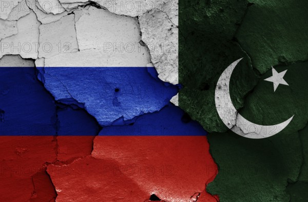 Flags of Russia and Pakistan painted on cracked wall