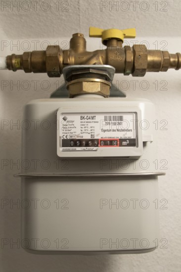 Symbolic image of energy costs in the household, natural gas, analogue gas meter in a flat,