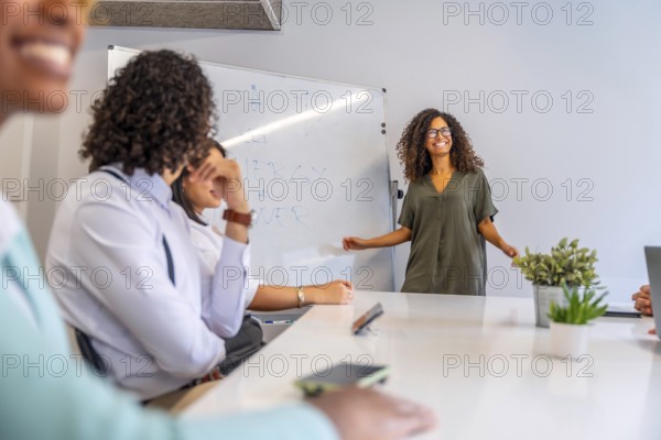 Woman smiling and transmitting good vibes in a meeting in a coworking
