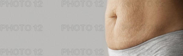 Close up woman belly with copy space