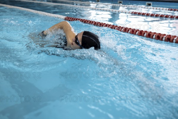 Portrait of a fit woman catcher in the pool. Portrait of a competitive female catcher near the use.