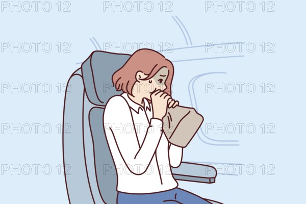Woman passenger of airplane suffers from aerophobia and breathes into paper bag, sitting in