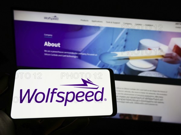 Stuttgart, Germany, 09-20-2022: Person holding cellphone with logo of US semiconductor company