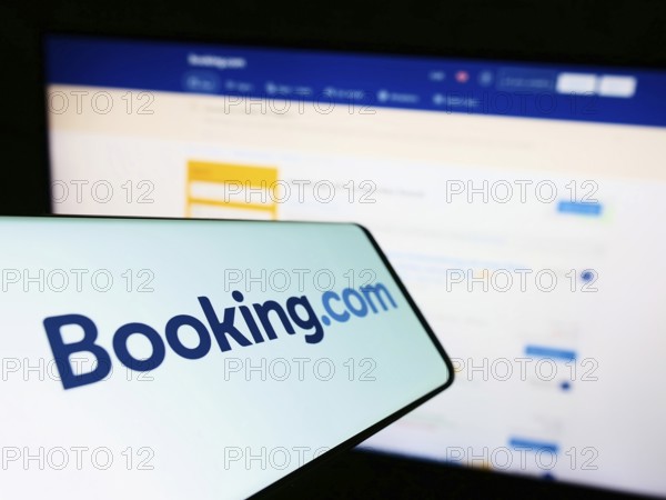 Stuttgart, Germany, 10-24-2022: Cellphone with logo of Dutch online travel agency Booking.com on