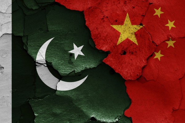 Flags of Pakistan and China painted on cracked wall
