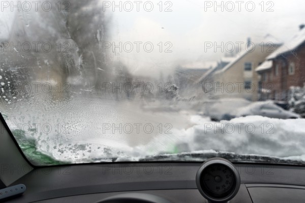 View through a steamed-up windscreen in winter