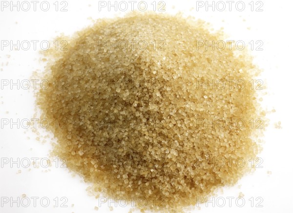 Brown caster sugar against white background