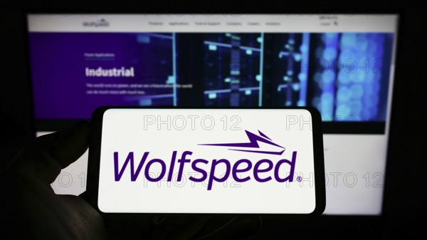 Stuttgart, Germany, 09-20-2022: Person holding smartphone with logo of US semiconductor company