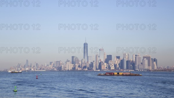 New York, United States of America, November 18, 2016: A container ship in front of the Lower