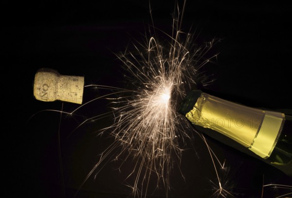 Champagne bottle cork pops on new year's eve