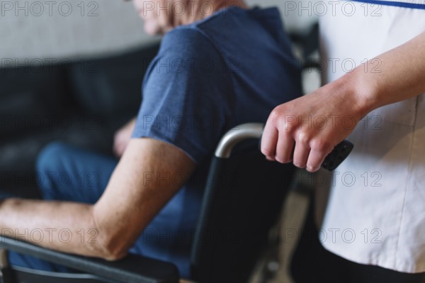 Man wheelchair old age home. High resolution photo