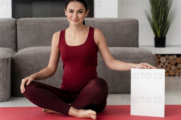 Pregnant woman posing white card