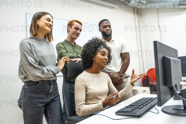 Diverse members of a coworking talking during online meeting together in the office