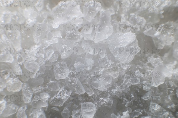 Macro view of crystals of table salt. Taste useful additive saline solutions background in shallow