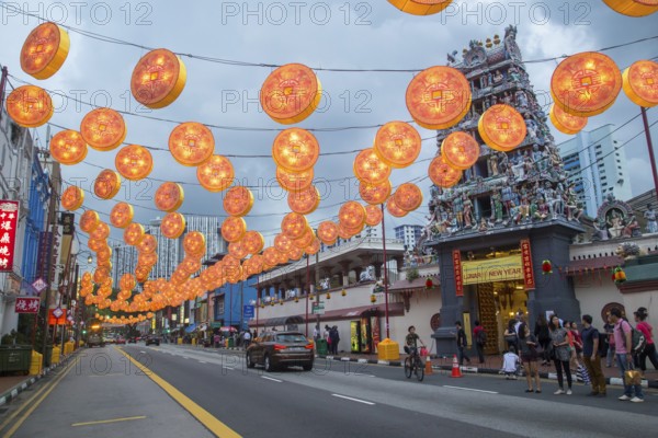 Singapore, Singapore, February 2, 2015: People on a street decorated for upcoming Chinese New Year