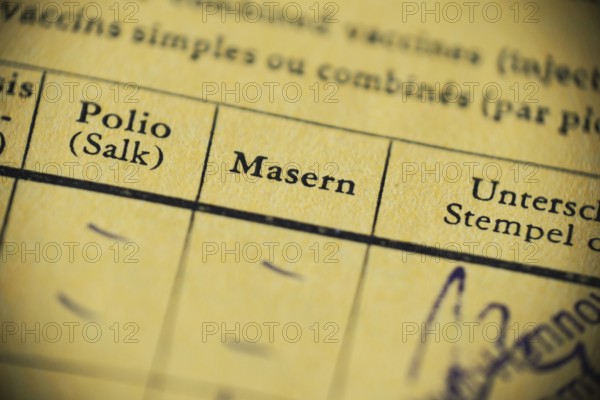 Masern is German for measels - international certificate of vaccination - anti-vaccination concept
