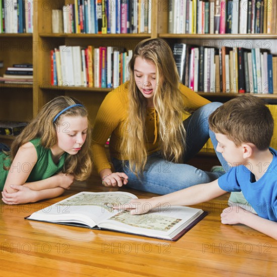 Kids looking pictures library book