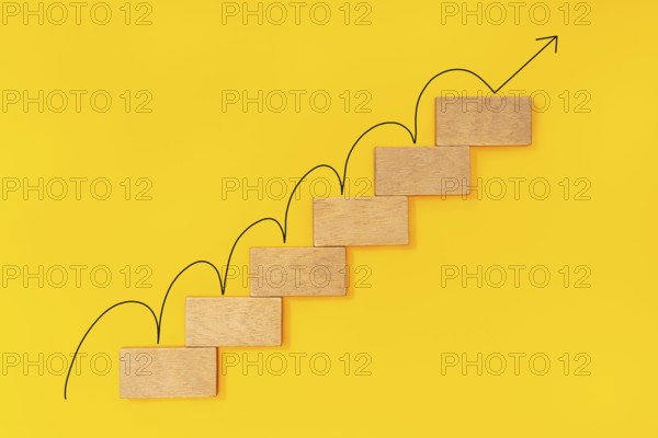 Rising arrow on wooden staircase. Growth concept, Ladder of success in business