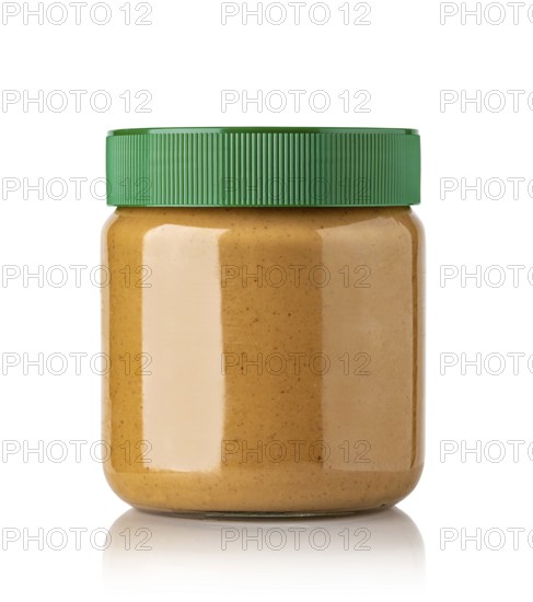 Jar of peanut butter on a white background