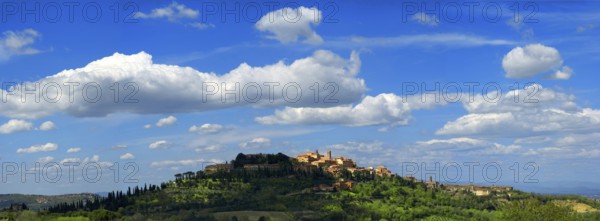 Panorama panoramic town view, cityscape of Montepulciano with blue sky and white clouds, Tuscany,