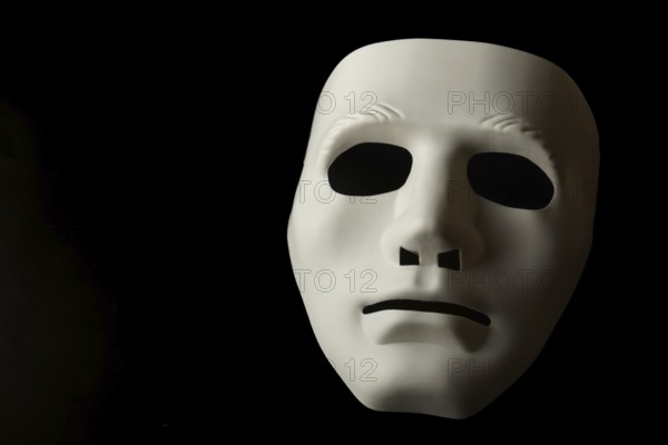 White mask isolated on black background
