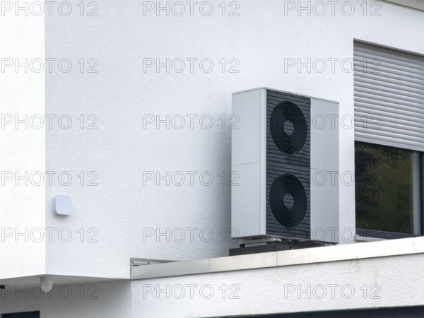 Heat pumps on the garage roof of a detached house in Hilden, Germany, Europe
