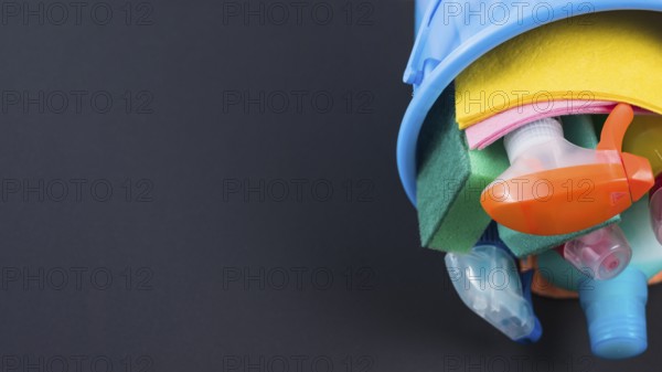 Cleaning products basket black background
