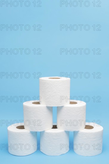 Front view toilet paper rolls stacked pyramid shape