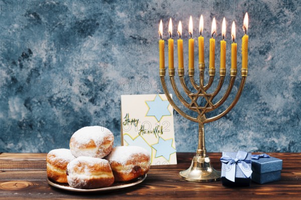 Traditional hanukkah sweets with candles
