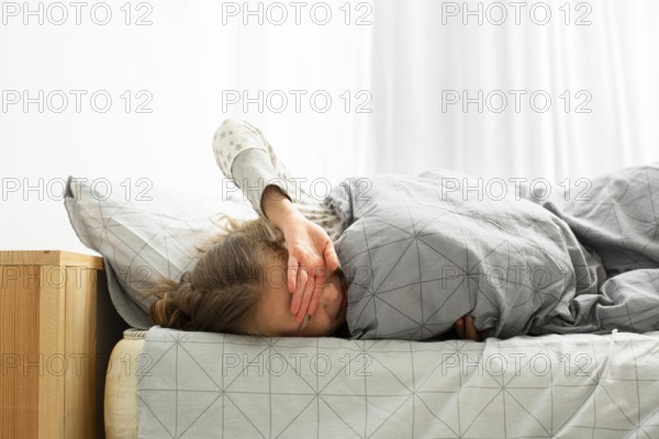 Front view sleeping girl waking up