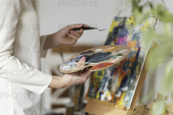 Young blonde woman painting with acrylics. Resolution and high quality beautiful photo