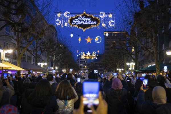 The illuminated lettering Happy Ramadan shines on the evening of 10 March 2024 as part of a light