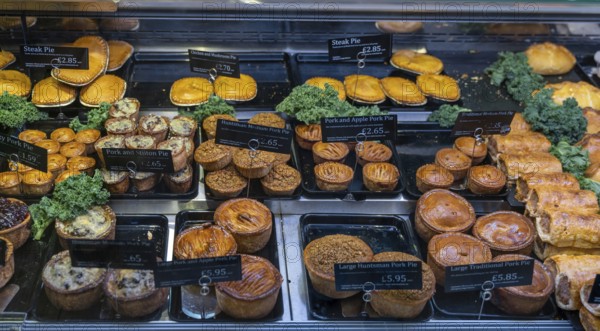 Conwy, United Kingdom, 27 August, 2022: close-up view of a butcher shop showcase with a variety of