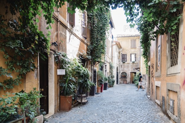 Rome, Italy, August 20, 2016: Picturesque pedestrian street in Trastevere a sunny summer day in