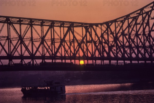 Sun set, Howrah bridge built in 1941 (Rabindra Setu) in Kolkata or Calcutta, West Bengal, India,