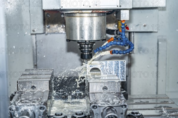 A cnc milling machine drilling a mould in a modern factory
