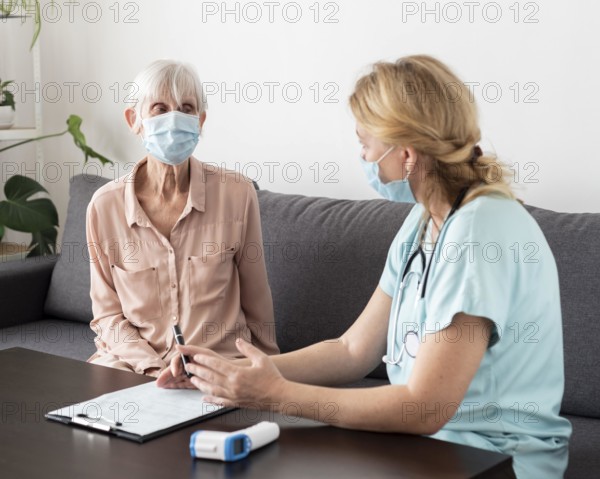 Nurse elder woman conversing nursing home