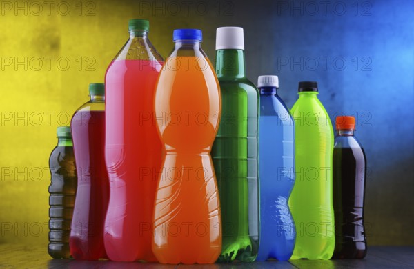 Plastic bottles of assorted carbonated soft drinks in variety of colors
