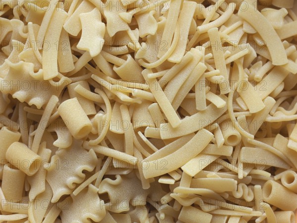 Mixed pasta of various shapes background