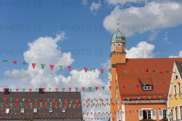 Mainburg in Lower Bavaria, market square with town hall in imperial weather in summer, decorated