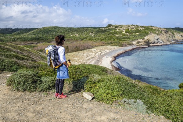 Hiker on Tortuga beach, s'Albufera des Grau Natural Park, Menorca, Balearic Islands, Spain, Europe