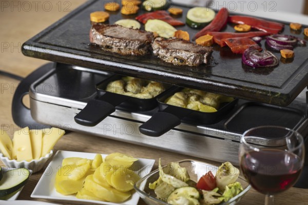 Swiss raclette with meat and vegetables