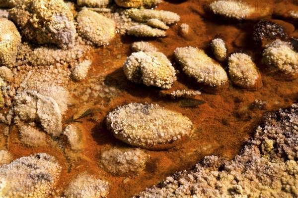 Stones with crystals in acidic rio Tinto, Spain, Europe