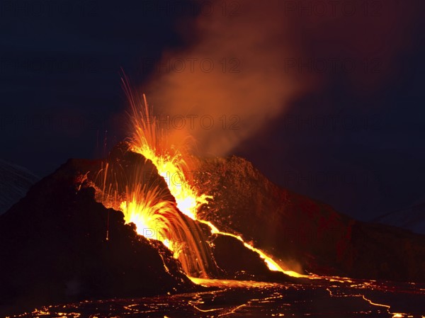 Breathtaking view of volcano eruption in Geldingadalir valley near Fagradalsfjall mountain,